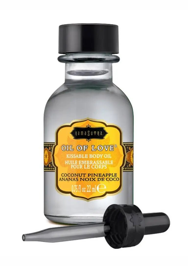 Kama Sutra Oil of Love Coconut Pineapple — clear glass apothecary bottle with golden amber label and precision dropper, 0.75 fl oz 22ml, product view