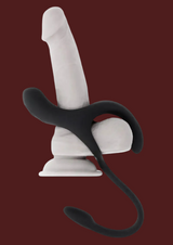Erovia Zero Tolerance All The Bases matte black silicone couples ring with three-point stimulation on a display base.